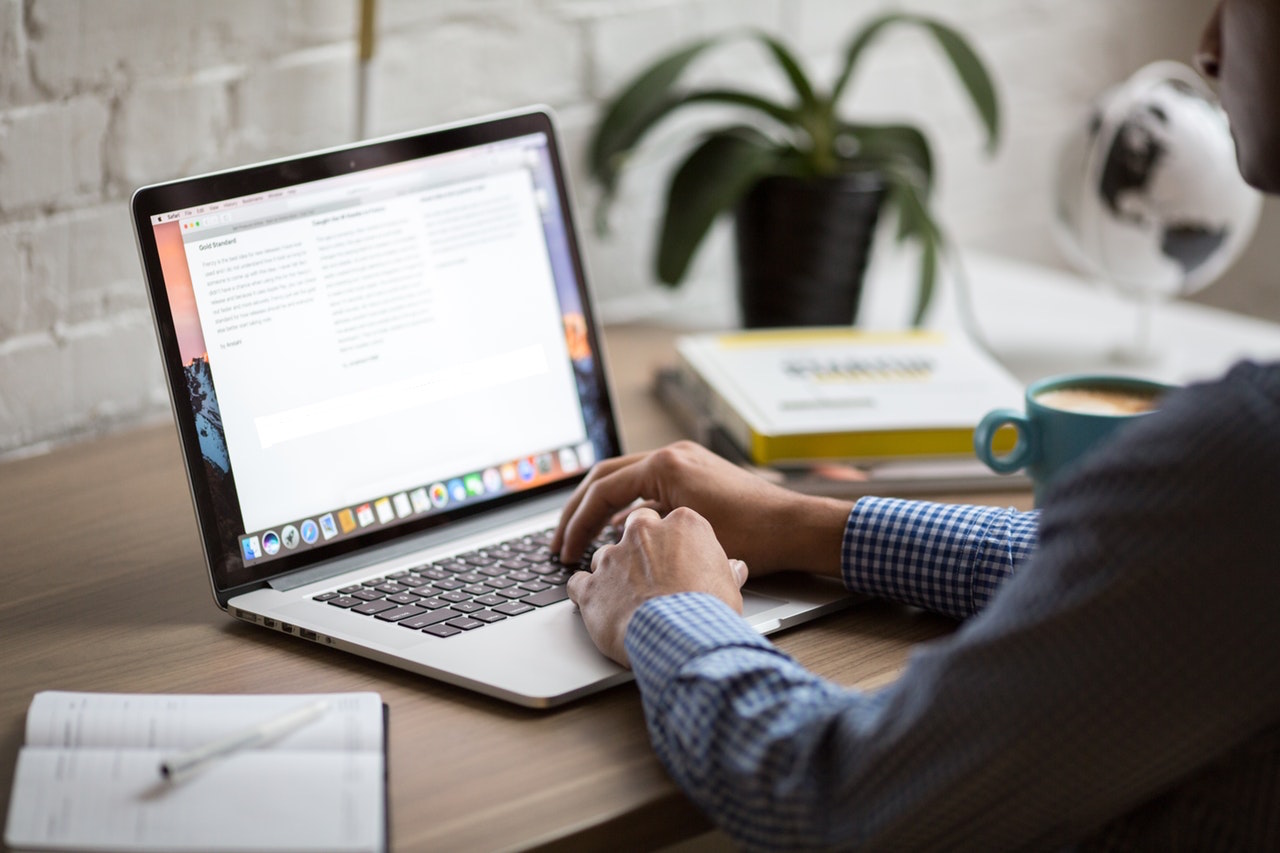 Man Filling Out Residential Lease on Computer